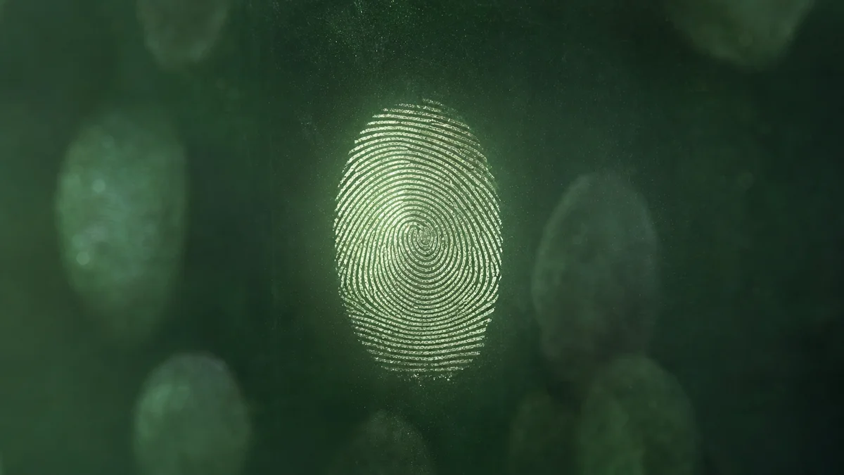 Macro photo of a fingerprint on glass, symbolising attribution tracing across touchpoints